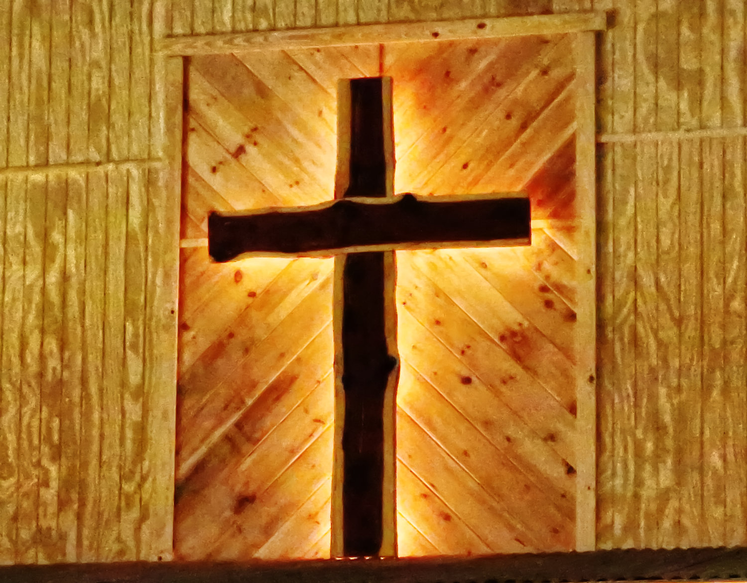 The illuminated cross at Wood County Cowboy Church